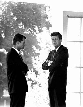 John Kennedy and Robert Kennedy confer.